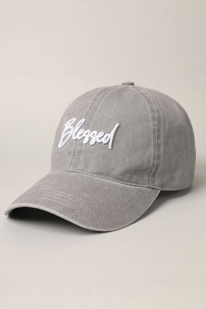 Gray, "Blessed" lettering, 6 panel design, pre-curved visor, comfortable fit, 100% washed cotton, adjustable metal strap