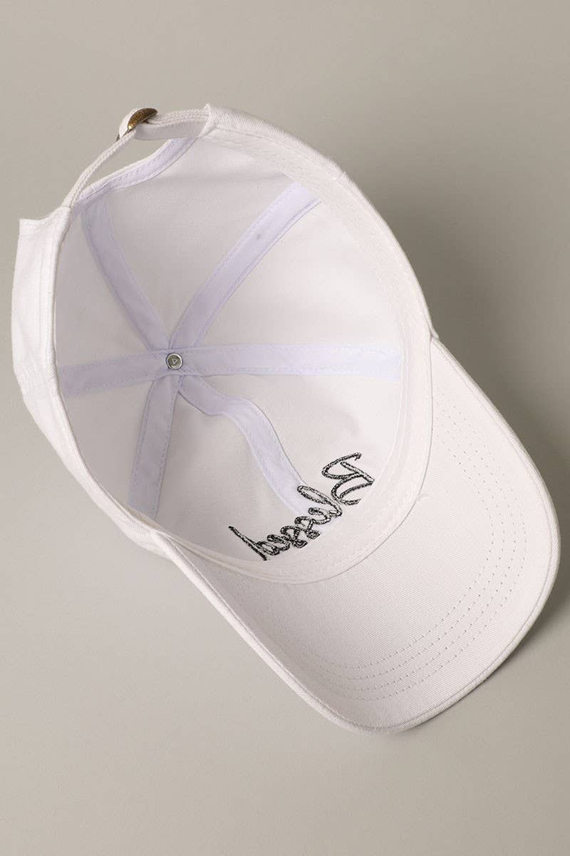 White,"Blessed" lettering, 6 panel design, pre-curved visor, comfortable fit, 100% washed cotton, adjustable metal strap, inside view
